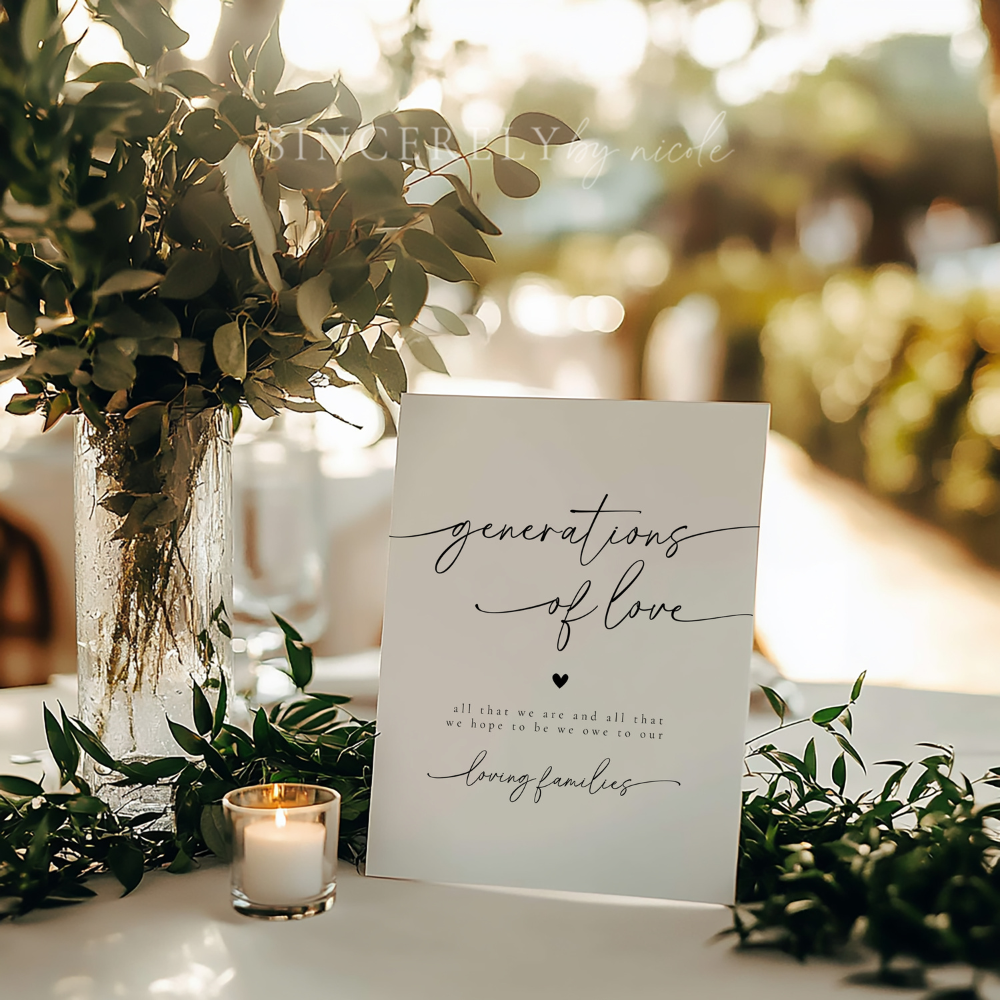 Minimalist "Generations of Love" sign styled with soft greenery and candles, set against a romantic wedding reception backdrop. This printed wedding sign beautifully expresses gratitude for loved ones and family heritage.